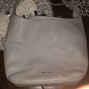 Grey Michael Kors hobo leather purse.